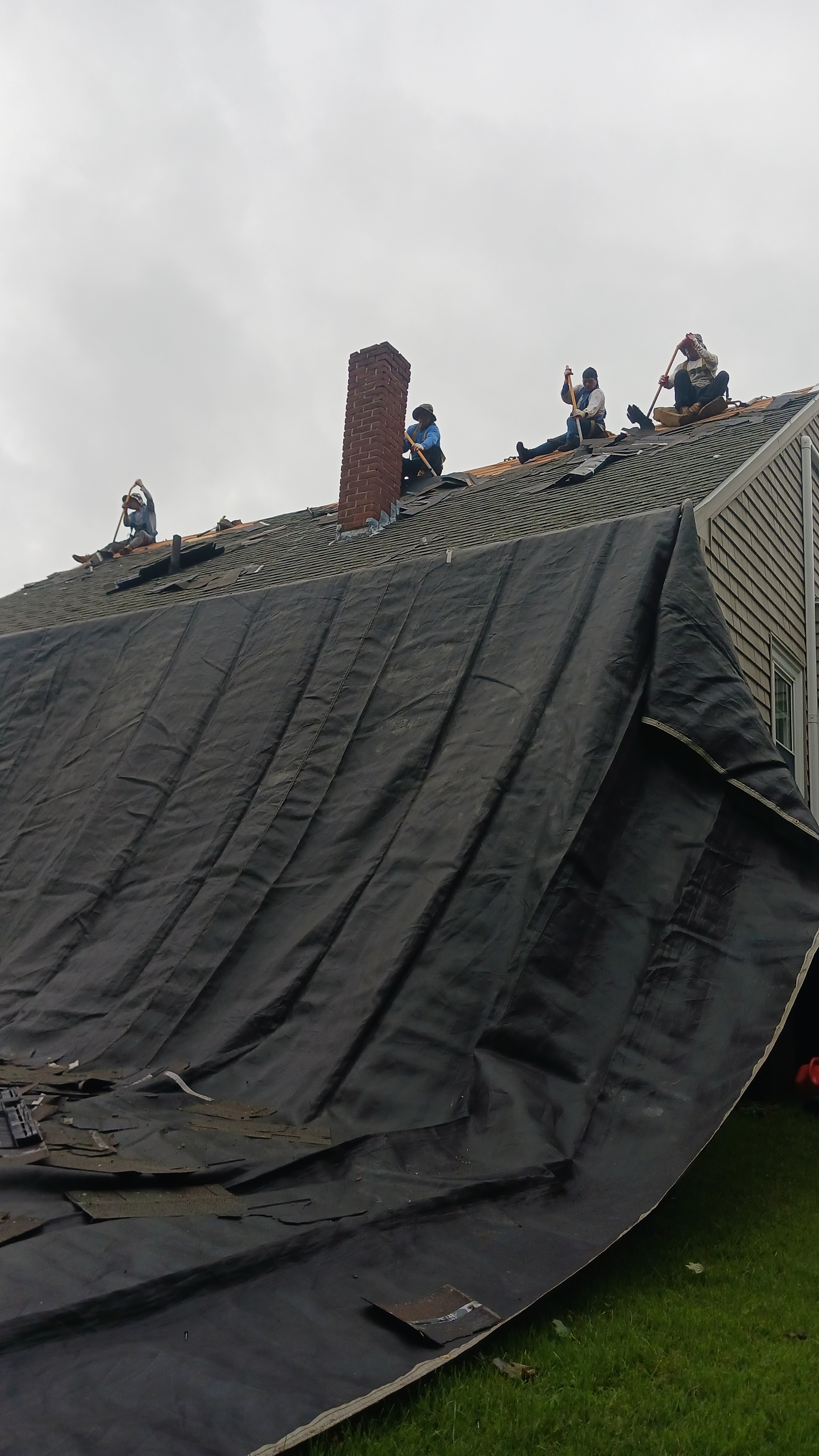 A group of people standing on top of a roof